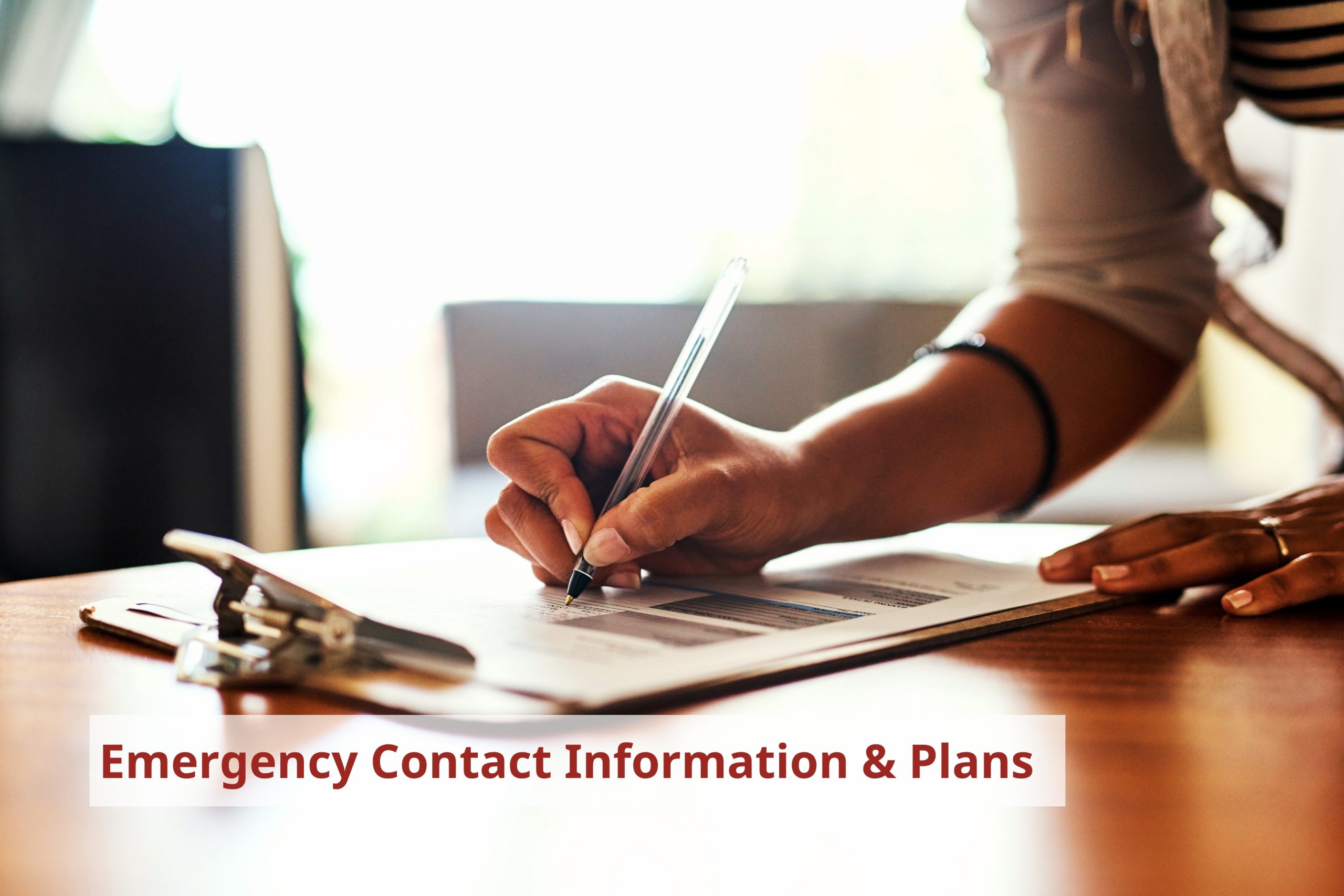 Person filling out a form. Credit: PeopleImages.