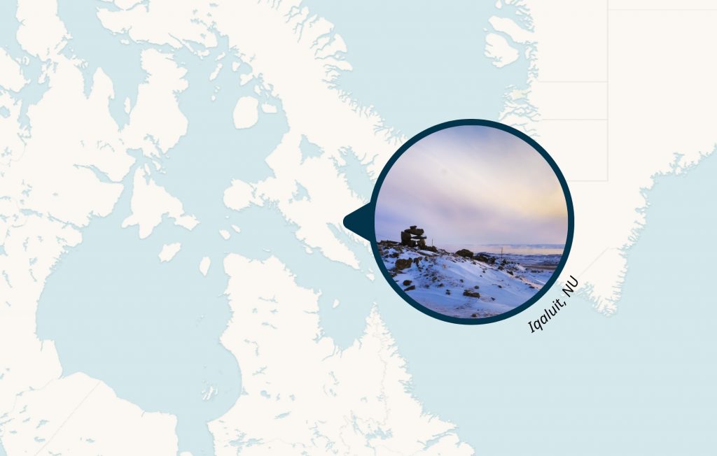Cover photo for the Iqaluit hotel modular project. Photo of Iqaluit in a circular frame, with a map of the area in the background. Photo credit: Rahul Aggarwal.